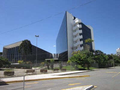 A modern institutional building in Curitiba with a glass facade